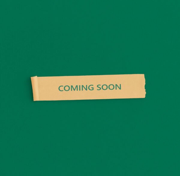 sticky-notes-with-text-coming-soon-green-background-store-opening-concept
